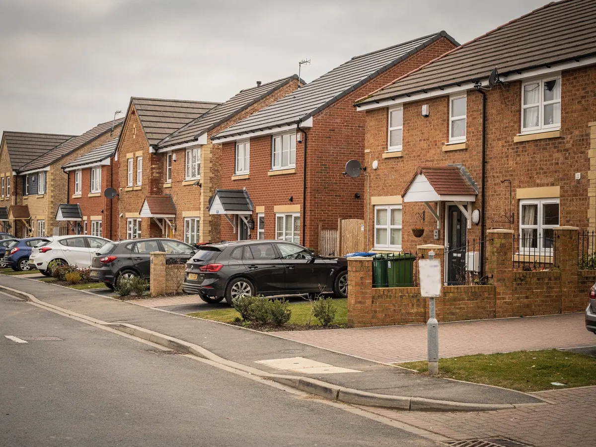 Street of new-build brick houses on a modern estate