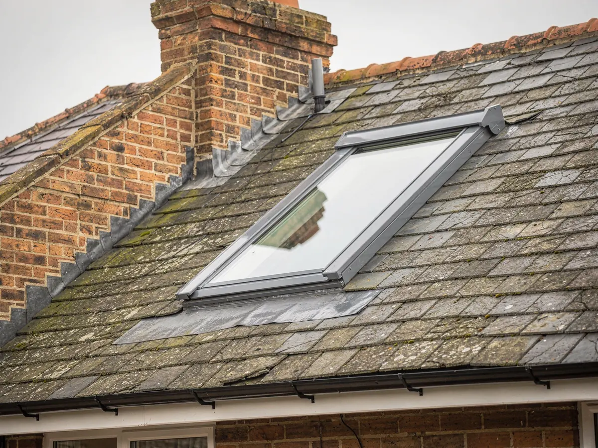 Roof window set into a slate roof